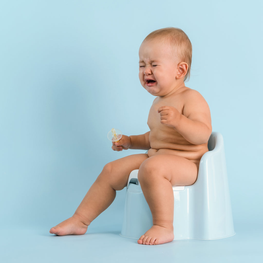 Baby straining and crying to sales poop but not constipated